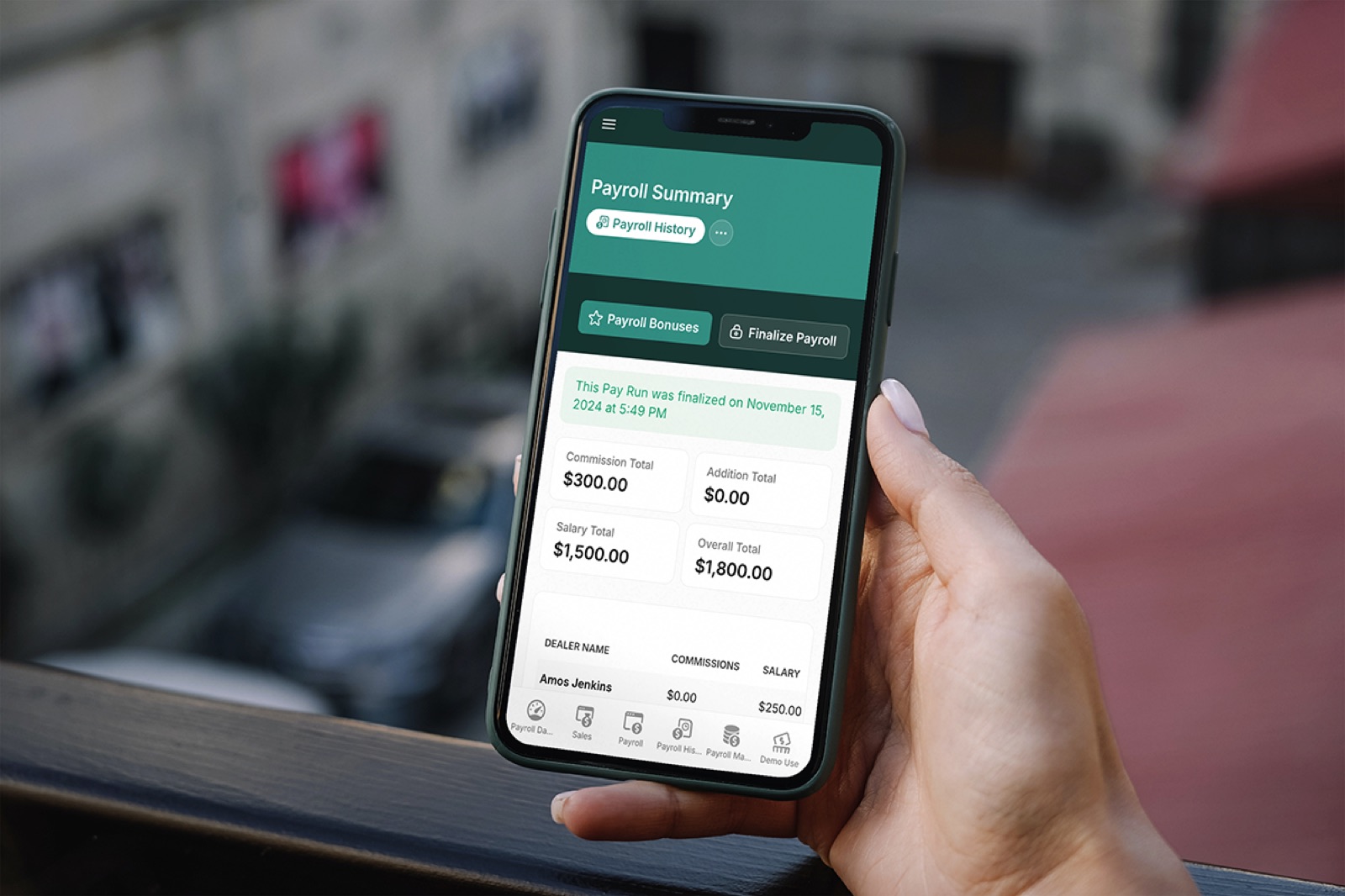 Payroll summary on a phone in hand